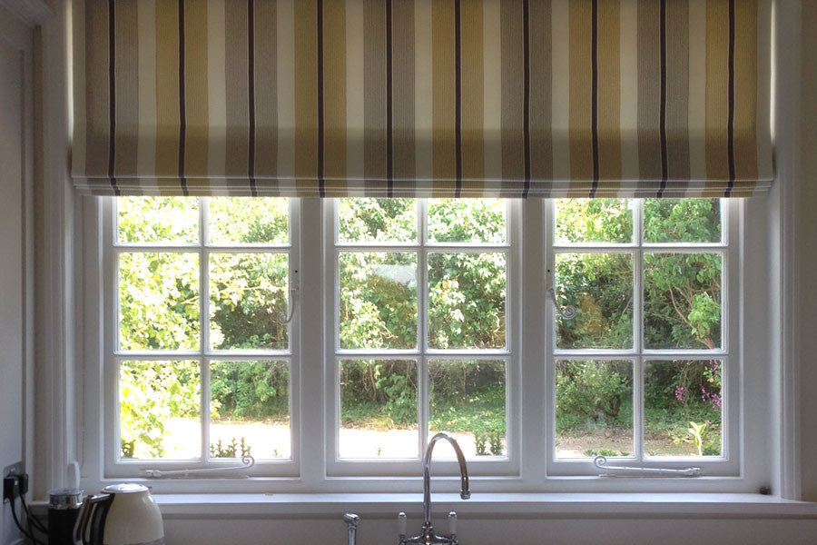 Stripe Roman Blinds are perfect for this stunning new kitchen